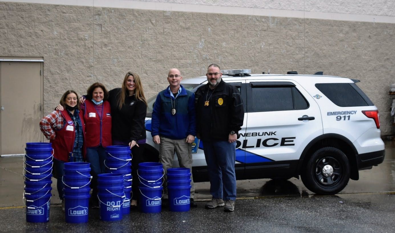Officers pick up donated buckets from Lowe's Home Improvement